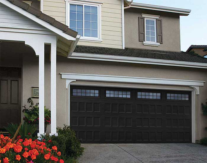 House with new dark colored garage